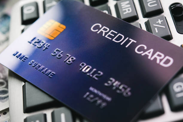 istock Credit card on calculator background for financial concept 1255604827