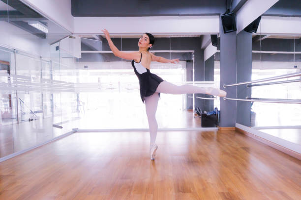 istock Young ballet dancer training at the studio on her own 1255604988
