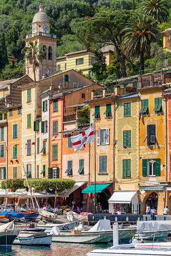 Boats, Businesses, Tourists and Beauty are what you see in the Portofino Italy Harbor. Tourists love to stroll the sidewalks by the bay in Portifino Italy shown here in late May.