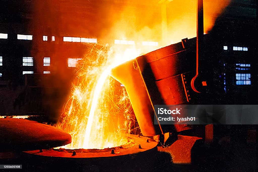 large bowl of molten metal at a steel mill. Steel production. A large bowl of molten metal at a steel mill. Steel production. Steel Mill Stock Photo