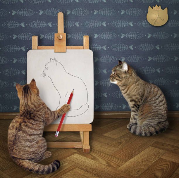 istock Cat2 artist drawing his friend 1255607943