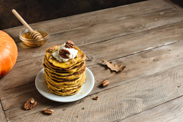 istock Pumpkin pancakes with pecan and honey 1255612080