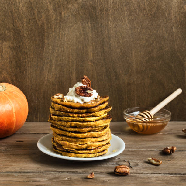istock Pumpkin pancakes with pecan and honey 1255612166