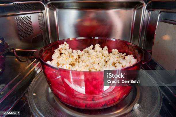 Popcorn Prepared In Microwave Oven Stock Photo - Download Image Now - Microwave, Popcorn, Inside Of