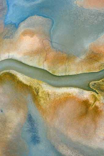Aerial view of beautiful natural shapes and textures in lake. Taken via drone.