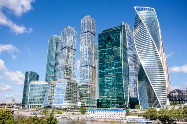Cityscape of Moscow city with skyscrapers of Moscow International Business Center (MIBC). Blue sky with few clouds on a summer morning. Modern office buildings theme.