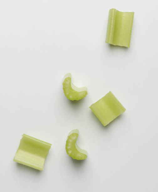 istock Heap of chopped celery sticks on white background 1255614422