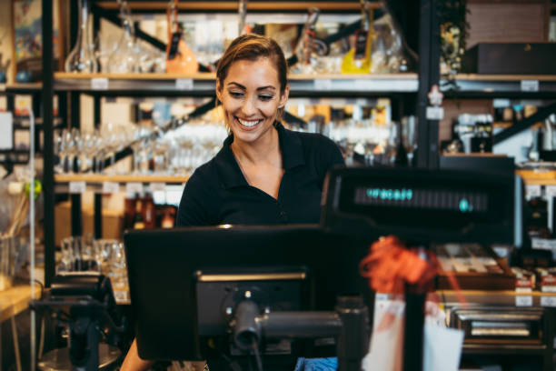 istock Female cashier with protective mask 1255616516