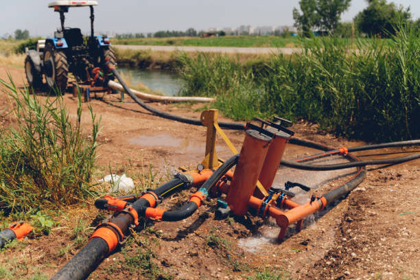 istock The pumping station where water is pumped from a irrigation canal, and distributed to irrigation sprinklers in farm fields. 1255618256
