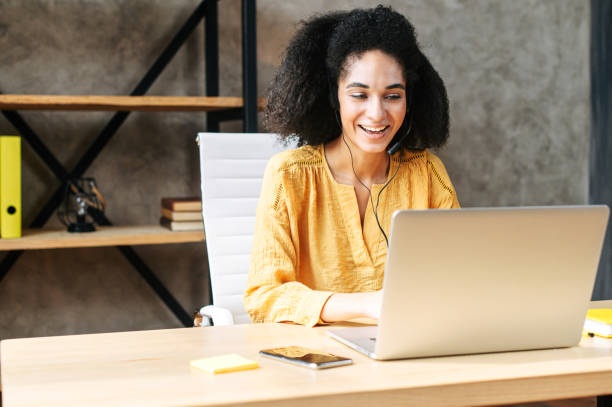 istock An african-american young woman uses headset 1255619066