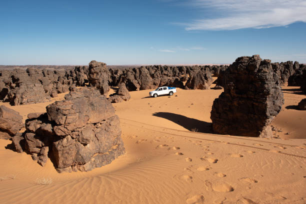 istock a 4x4 car in the Libyan Sahara desert. 1255621454