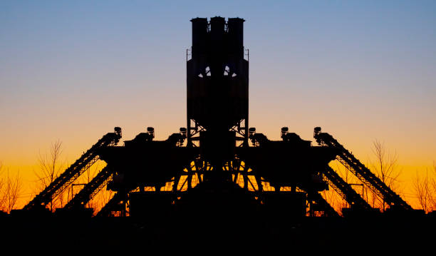 istock Giant industrial machine silhouetted at twilight 1255622293
