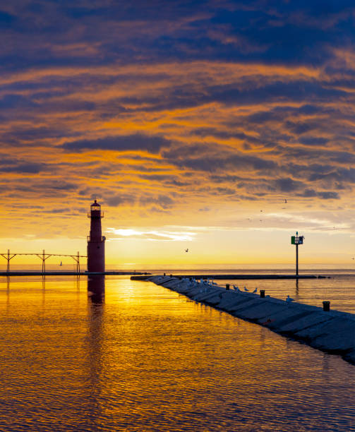 istock Amazing down sky over tranquil harbor with lighthouse. 1255622392