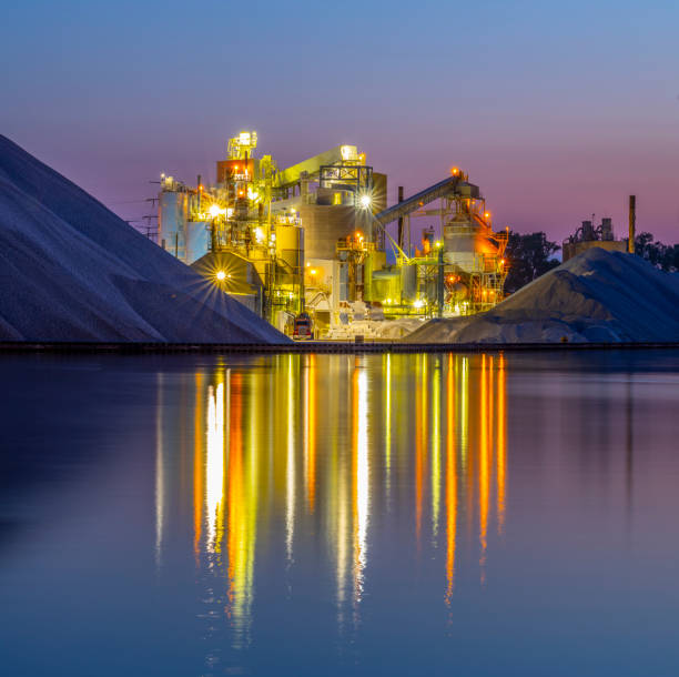 istock Giant industrial grinding machine illuminated at dawn 1255623112