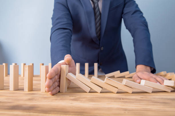istock man hand wooden cubes 1255623382