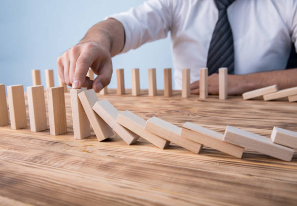 istock man hand wooden cubes 1255623383