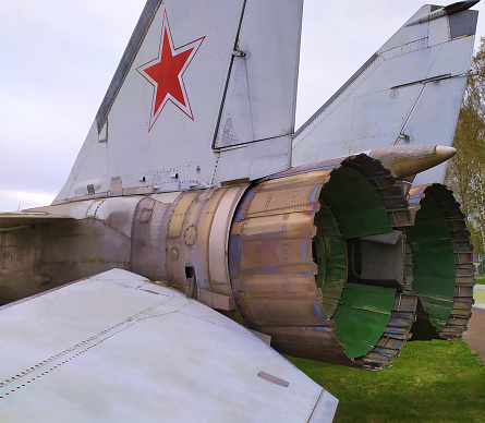 The fuselage of a Soviet fighter with turbines and a red star on the tail