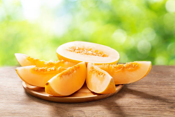 istock fresh melon slices on a wooden board 1255628155
