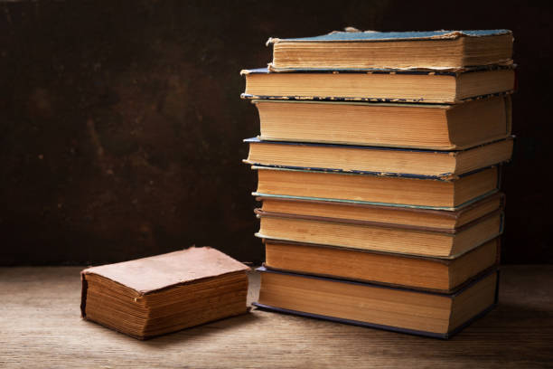 istock old books on a wooden desk 1255628156