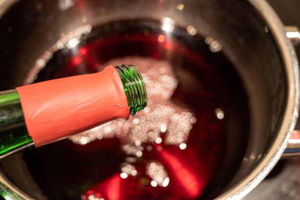 istock a mulled wine is poured into a saucepan to heat it up 1255629023