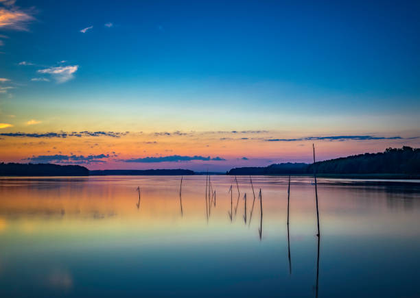 istock beautiful lake at sunset (HDRi) 1255633230