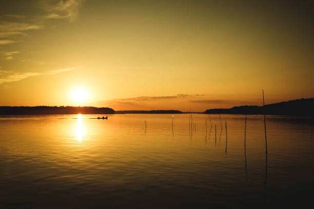 istock beautiful lake at sunset 1255633237