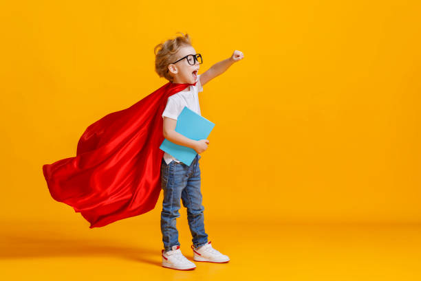 istock Little superhero studying at school 1255636637