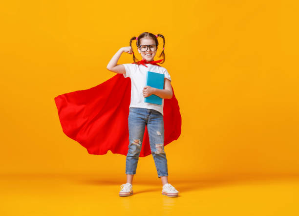 istock Happy smart superhero showing bicep 1255636675