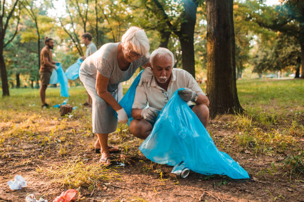 istock Seniors volunteering during cleaning the park 1255650911