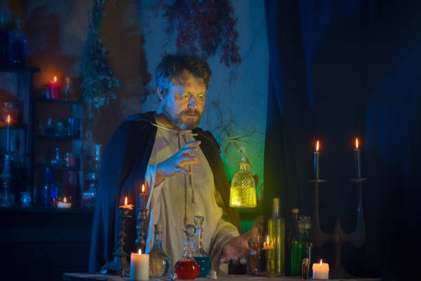 istock portrait of  wizard with burning candles and magic potions 1255651165