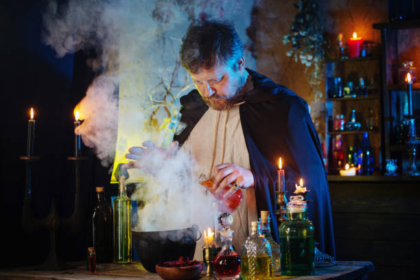 istock portrait of  wizard with burning candles and magic potions 1255651167