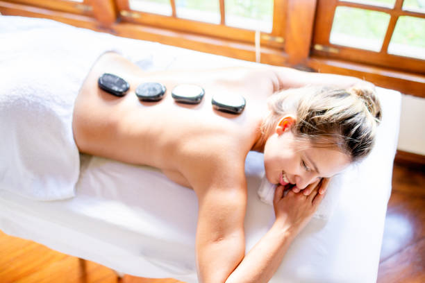 istock Beautiful woman in a spa receiving massage 1255652280