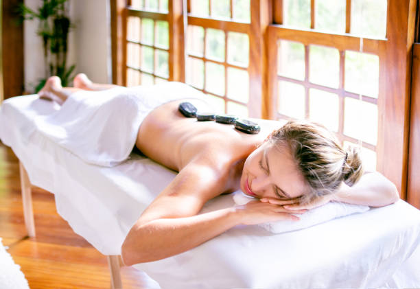 istock Beautiful woman in a spa receiving massage 1255652282