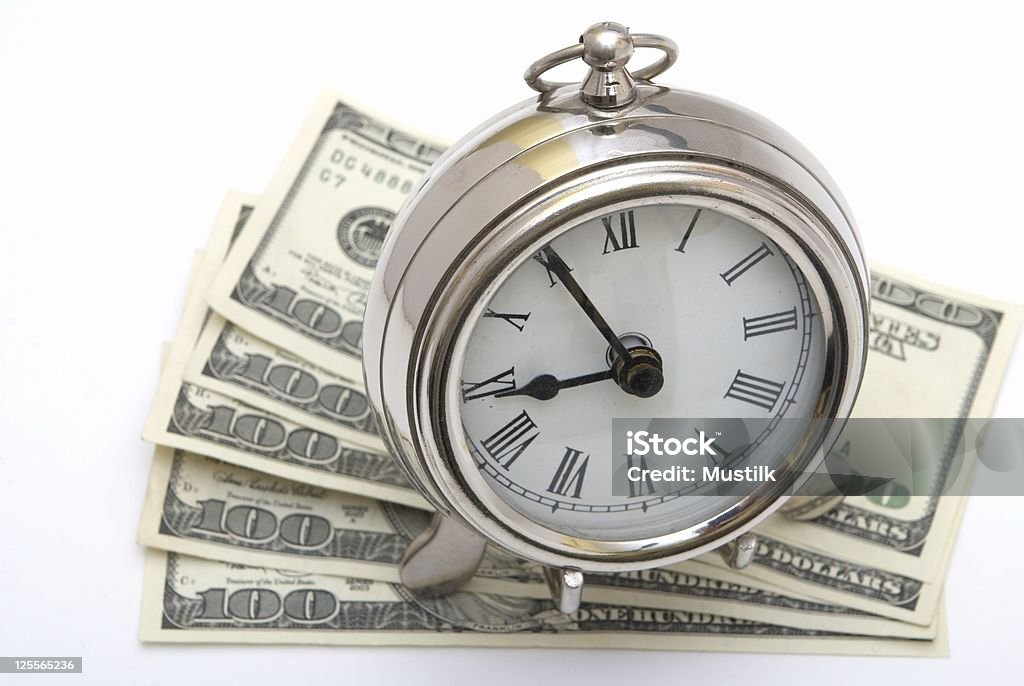Pieniądze i zegar - Zbiór zdjęć royalty-free (Banknot)
