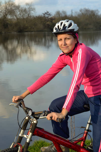 istock Woman commuting back from work cycling bike 1255653053