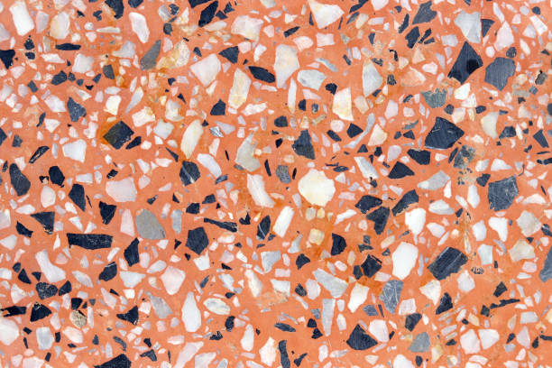 istock Decorative wall with beautiful fine black and white stone in pink cement wall. 1255657178