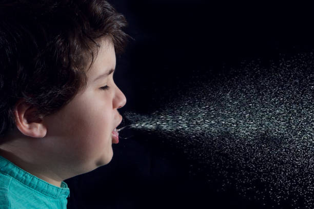 child sneezing stock photo