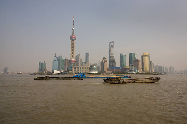 High angle view of industrial ships on the Huangpu river by the Bund, Shanghai, China.