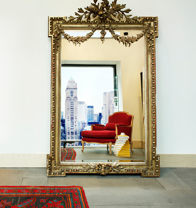 Reflection of a modern house from an antique mirror in a new York apartment