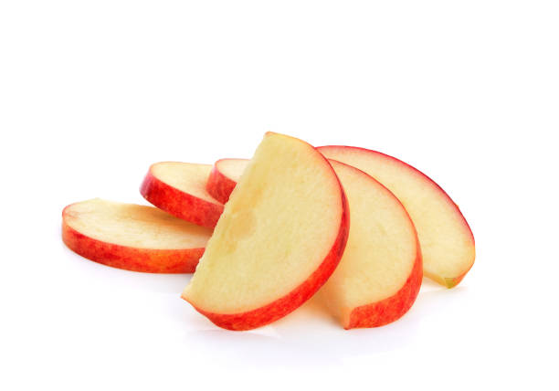 red apple sliced isolated on white - fatia imagens e fotografias de stock