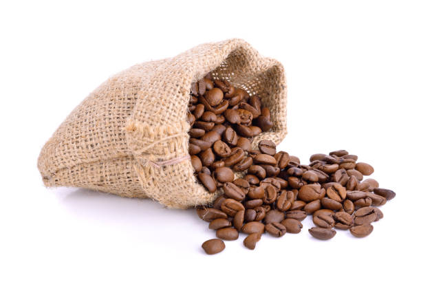 istock Coffee beans in sack bag isolated on white 1255669773