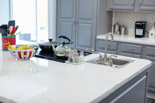 istock Counter Surface and Appliances with Fruit and Vegetable Basket in Modern Kitchen 1255676902