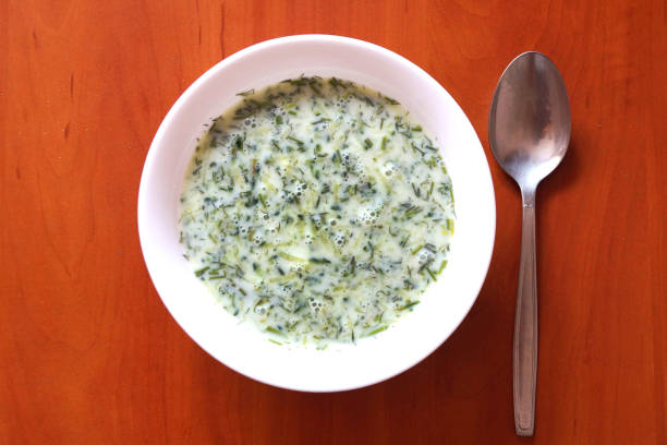 istock cucumber sour milk soup on a wooden table, top view. 1255680984