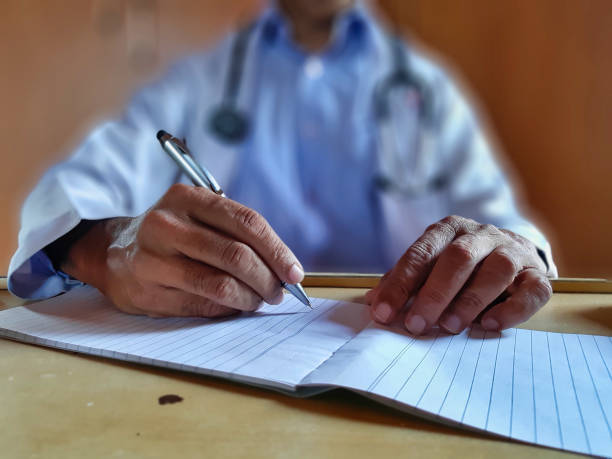 istock Doctor writing a prescription 1255681876