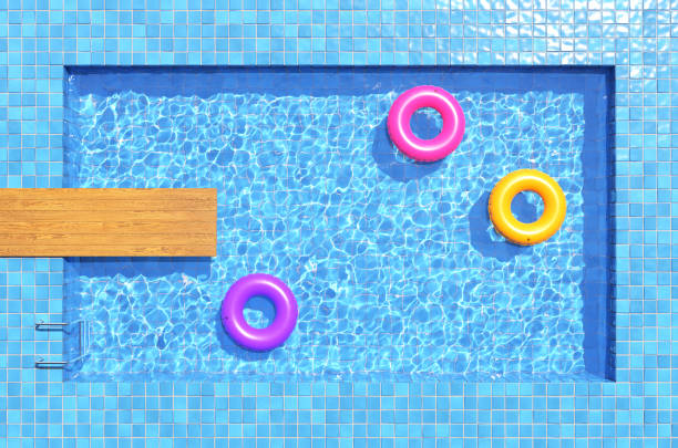 istock Colorful swimming rings in blue swimming pool. 3d illustration 1255683048