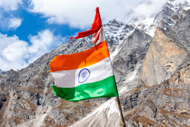 istock The Indian flag is waving in the sky at Himalayan mountain range in Satopanth Badrinath Uttarakhand India 1255683165