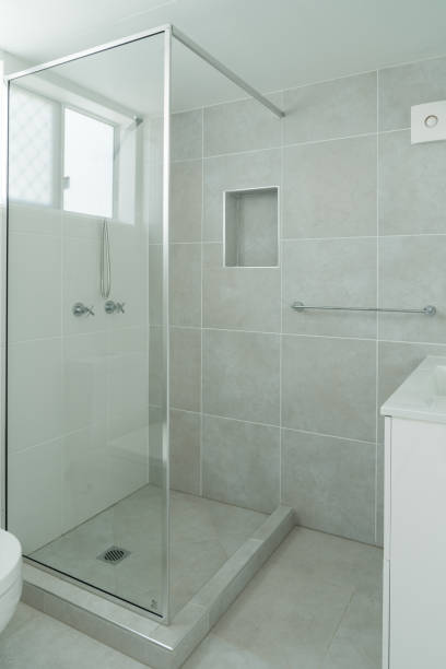 istock New bright white and gray tiled bathroom 1255684491