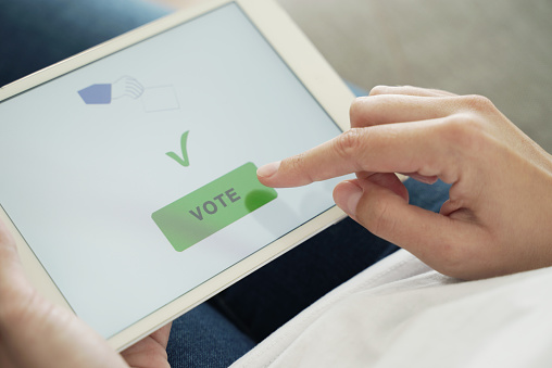 Woman Tap Vote Button on Digital Tablet. Voting Online Concept
