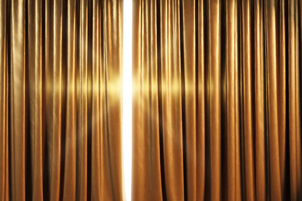 istock Empty theater stage with golden curtains. 3d illustration 1255690362