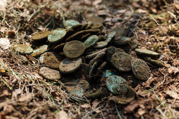 istock Real treasure with copper coins. Discovery, treasure hunting, digging, metal detection concept. 1255690533